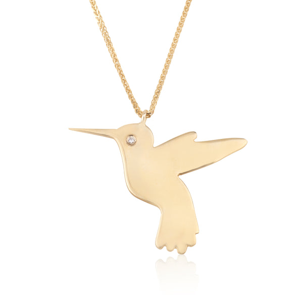 Flying bird gold pendant