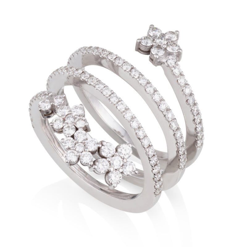 An open diamond pave swirl ring with diamond flowers