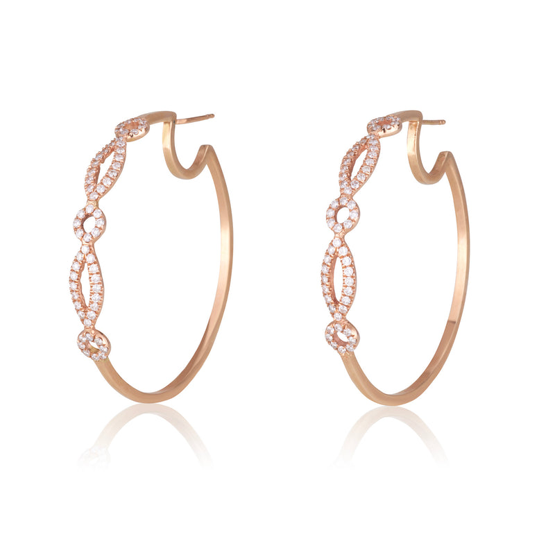 Cosmopolitan adorned hoop earrings with diamond pave geometrical patterns