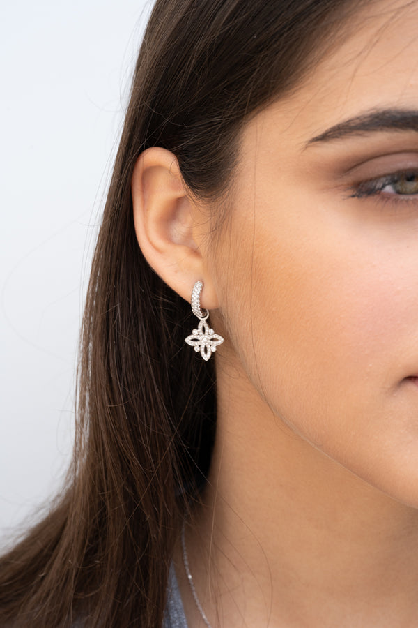 Iris diamond huggie earrings with